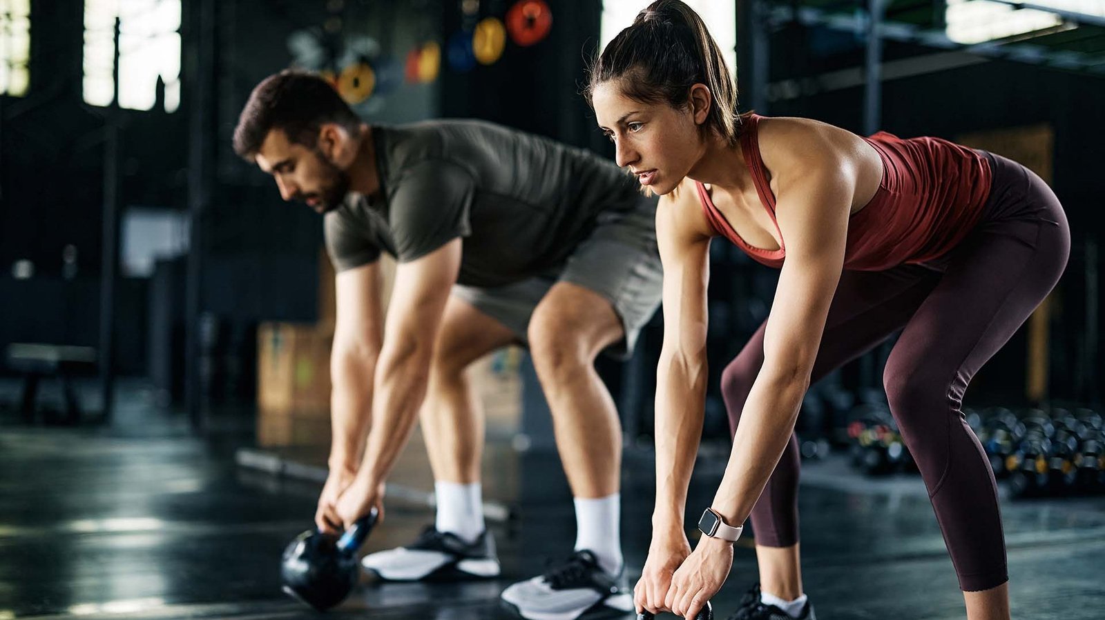 Two athletes in the gym - gym workouts to swim faster